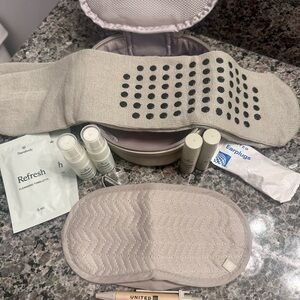Therabody Bag w/travel items: hydrating mist, eye serum, socks, eye mask, & more
